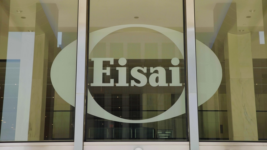 Glass windows decorated with the Eisai logo in white