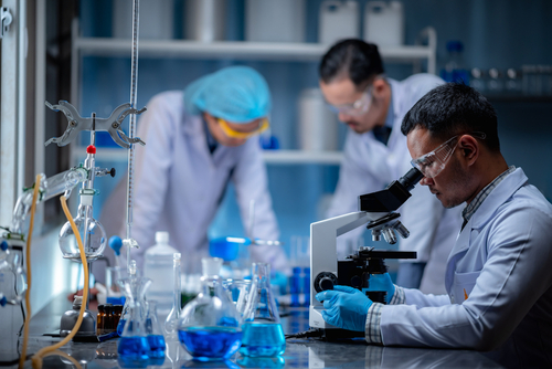 Three scientists working in a lab