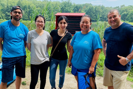 A photo of five Eisai employees volunteering at Camp Nova